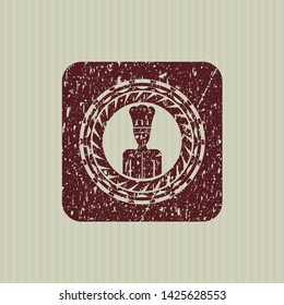 Red chef icon inside distress with rubber seal texture