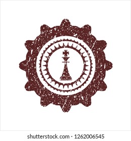 Red chess king icon inside distress grunge seal