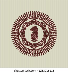 Red chess knight icon inside rubber stamp
