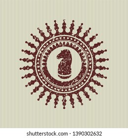 Red chess knight icon inside distressed rubber stamp
