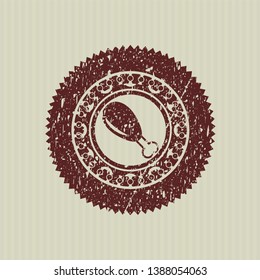 Red chicken leg icon inside distress rubber seal