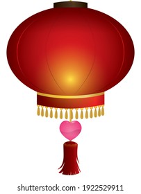 Red Chinese lantern decorated with fringes, tassel and a pink heart, for a lovely date during the Lantern Festival.