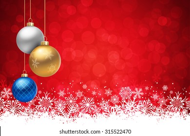 A Red Christmas background, with many multicolored christmas balls decorated with snowflakes, hanging from above.