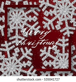 Red Christmas background with shining  silver snowflakes. 