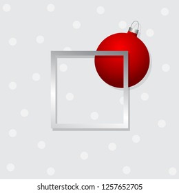 Red Christmas ball with silver frame on gray background. Template for design