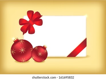 Red Christmas balls and blank invitation card over gold background 