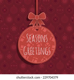 red christmas bauble background with hanging christmas decoration and text
