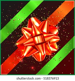 Red Christmas Bow with green tape and confetti on gift box