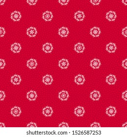 Red christmas seamless vector pattern. White doodle snowflakes, wreaths and polka dots on red background. Cute hand-drawn holiday texture design. Gift wrapping paper, festive social media backdrop.