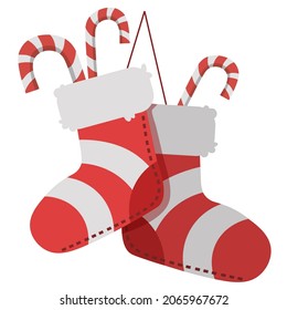 Red Christmas socks with candy cane, celebration merry Christmas. Greeting card and traditional symbol for Christmas or New Year. Winter holiday decoration concept on white background.