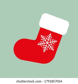 Red Christmas stocking with white snowflake on green background. Vector Christmas gift sock. Flat vector Illustration. Simple design for web and print. Xmas icon
