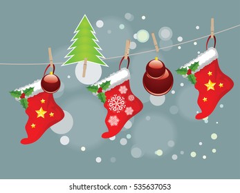 Red Christmas stockings hanging on a rope with wood pegs.