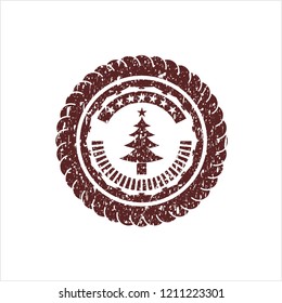 Red christmas tree icon inside distressed rubber seal