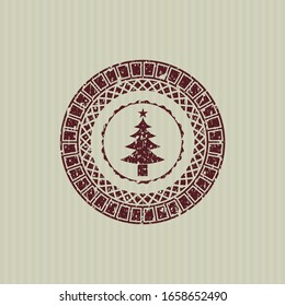 Icono de árbol de Navidad rojo dentro de un sello de goma angustiado con textura gruesa