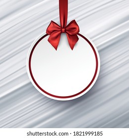 Red christmas tree toy outline on white background with red bow. Space for your text. Light grey flowing silk background. Vector holiday illustration.