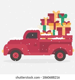 Red christmas truck On the car there are small and big presents to celebrate or decorate on Christmas and New Year.