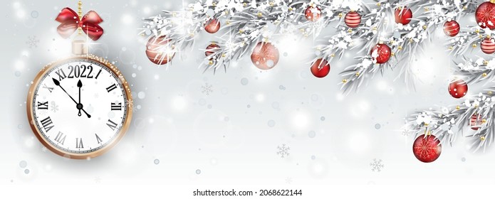 Red clock with date 2022 and frozen fir twigs with red baubles. Eps 10 vector file.