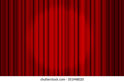 Red closed curtain with light spots in a theater for your design.