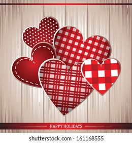 Red cloth handmade hearts on wooden background. Vector illustration