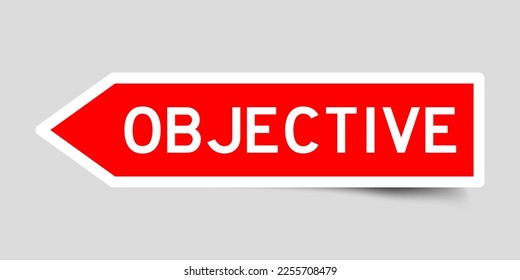 Red color arrow shape sticker label with word objective on gray background