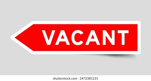 Red color arrow shape sticker label with word vacant on gray background