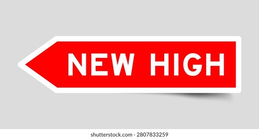 Red color arrow shape sticker label with word new high on gray background