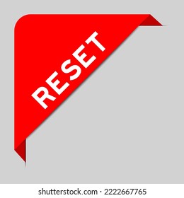 Red color of corner label banner with word reset on gray background