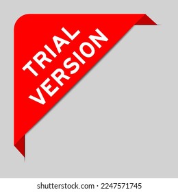 Red color of corner label banner with word trial version on gray background