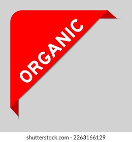 Red color of corner label banner with word organic on gray background