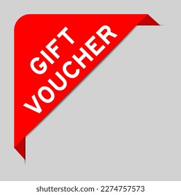 Red color of corner label banner with word gift voucher on gray background