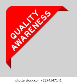 Red color of corner label banner with word quality awareness on gray background