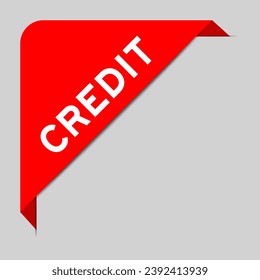 Red color of corner label banner with word credit on gray background