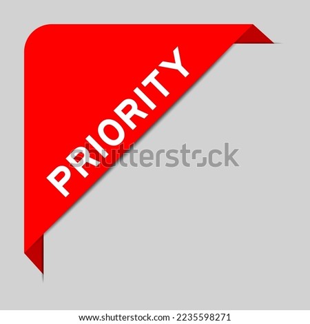 Red color of corner label banner with word priority on gray background