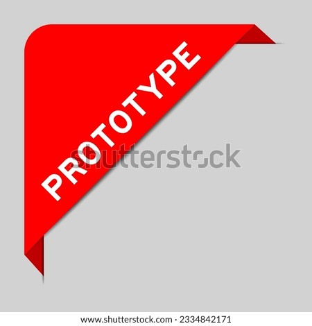 Red color of corner label banner with word prototype on gray background