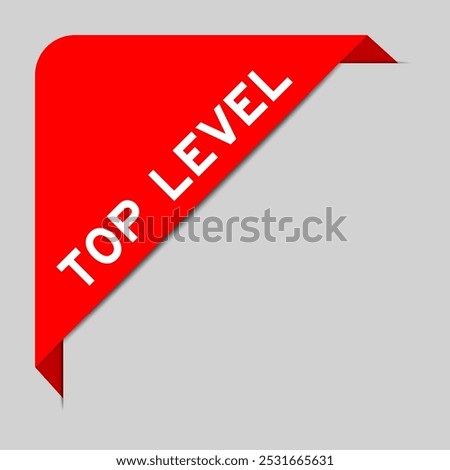 Red color of corner label banner with word top level on gray background