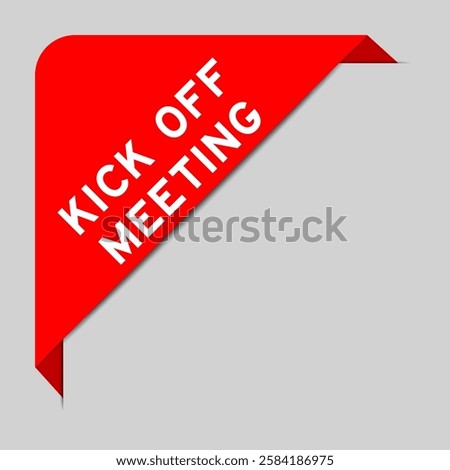 Red color of corner label banner with word kick off meeting on gray background