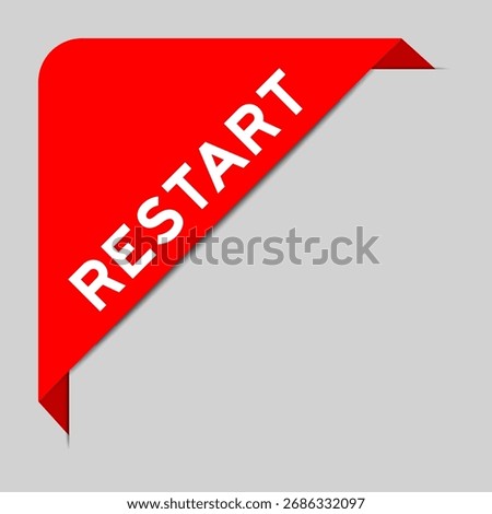 Red color of corner label banner with word restart on gray background