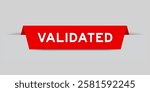 Red color inserted label with word validated on gray background
