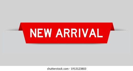 Red color inserted label with word new arrival on gray background