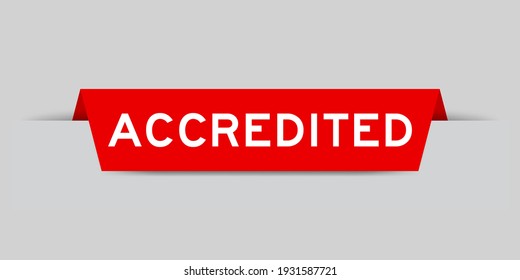 Red color inserted label with word accredited on gray background