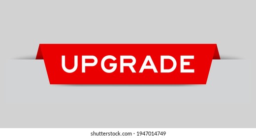 Red color inserted label with word upgrade on gray background