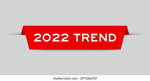 Red color inserted label with word 2022 trend on gray background