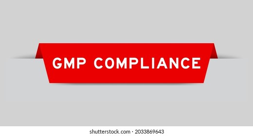 Red color inserted label with word GMP  (Abbreviation of good manufacturing practice) compliance on gray background