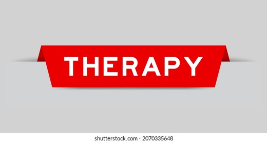 Red color inserted label with word therapy on gray background