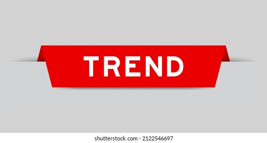 Etiqueta insertada de color rojo con tendencia de palabra sobre fondo gris