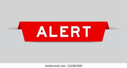 Red color inserted label with word alert on gray background