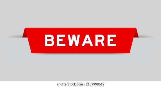 Red color inserted label with word beware on gray background