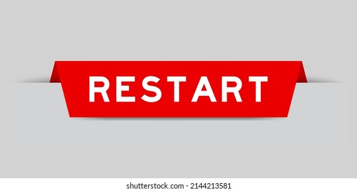 Red color inserted label with word restart on gray background
