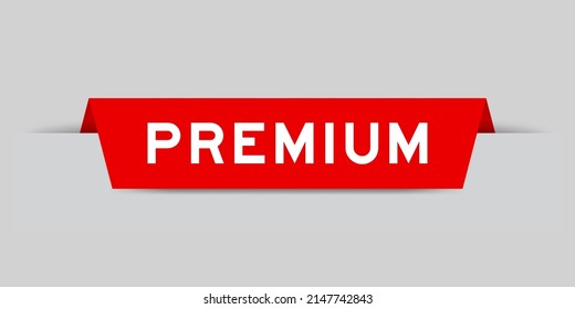 Red color inserted label with word premium on gray background