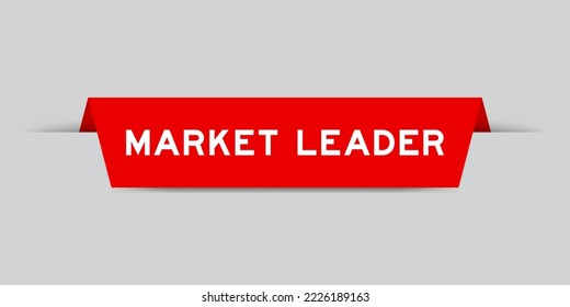Red color inserted label with word market leader on gray background